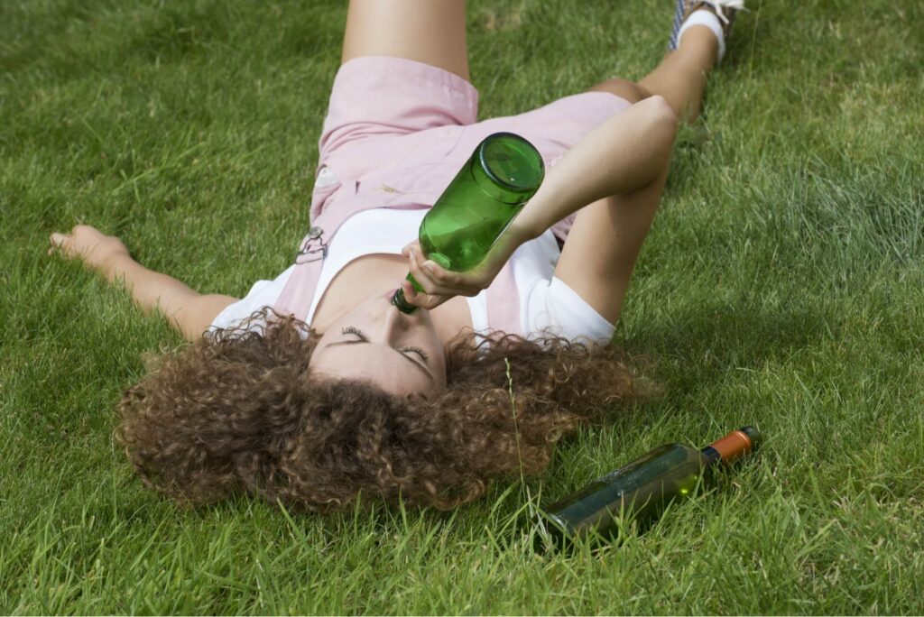 Woman Drinking Wine Being Publicly Intoxicated