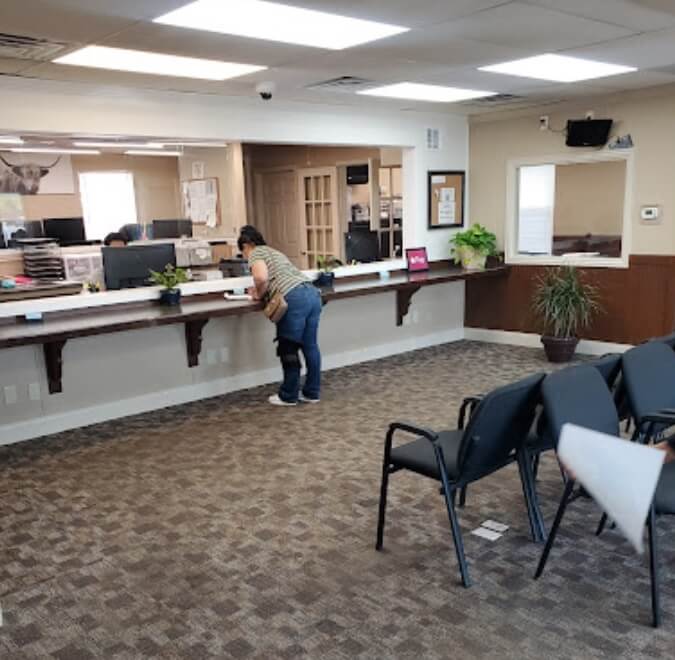 Customer completes bail bond paperwork inside 1st Call Bail Bonds Office in Dallas, TX